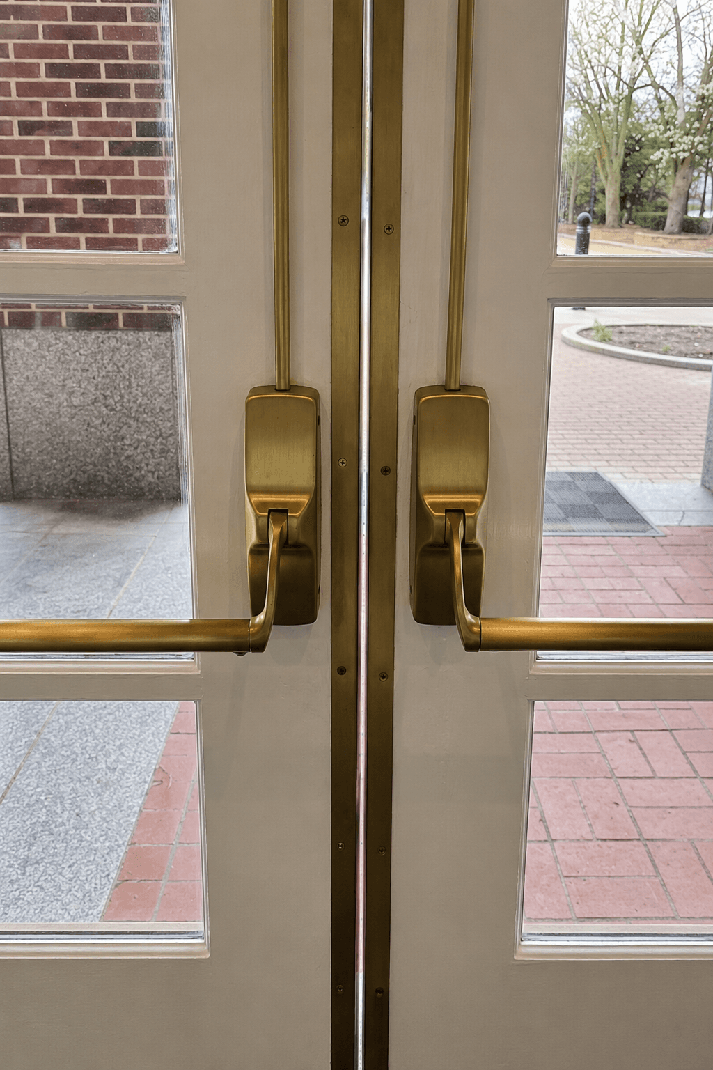 Polished brass door hardware after refinishing